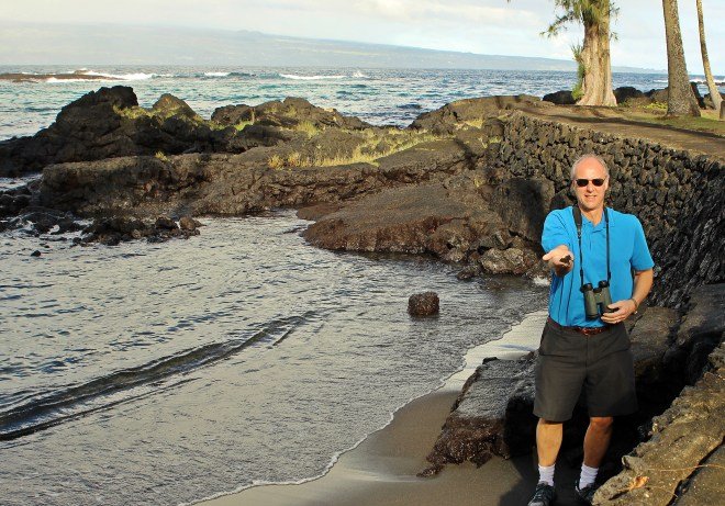 Conrad holding some of the black sand