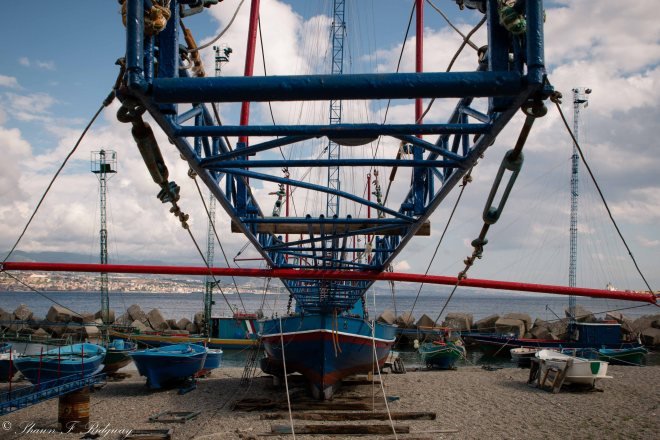 The walkway that they stand on to spear the fish
