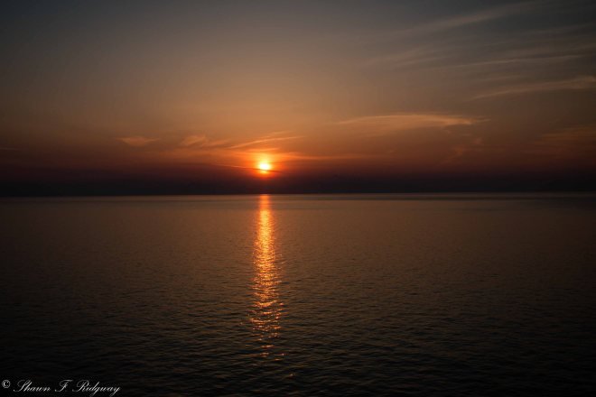 Sunset after dinner from the Sunset bar at the very top of the ship at the stern.
