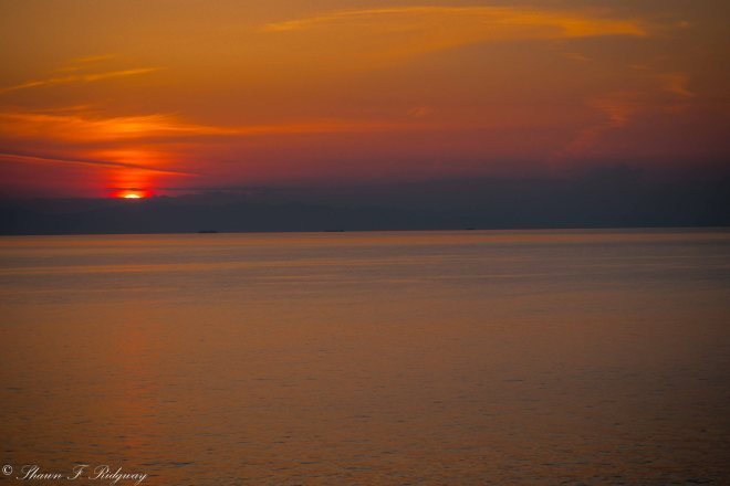 Sunset after dinner from the Sunset bar at the very top of the ship at the stern.