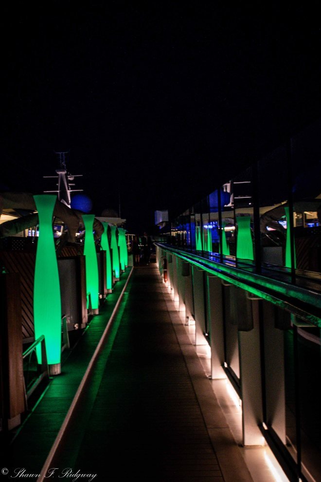 Walkway around the top of the ship at night.