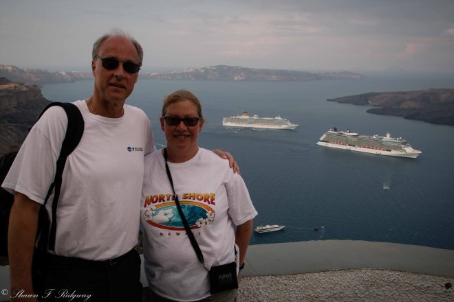 Some nice people took our picture looking down from the town of Fira into the harbor where our ship was docked.