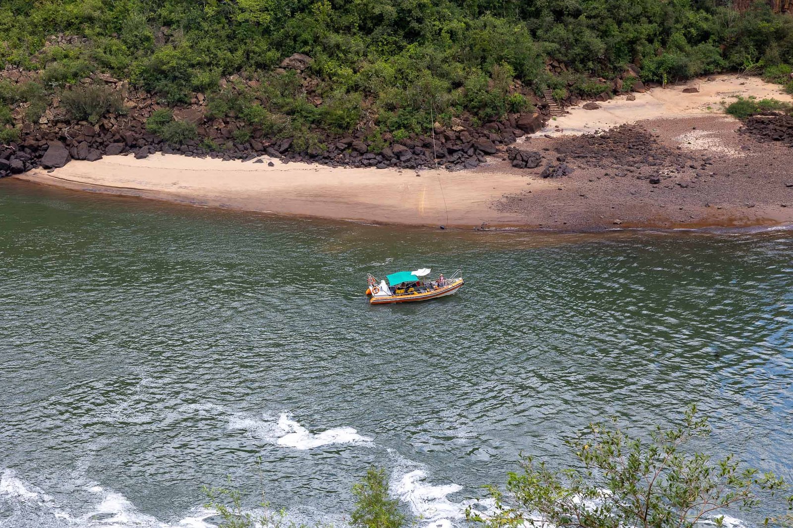 Safety boat for the boats that go up the arpids and under the falls