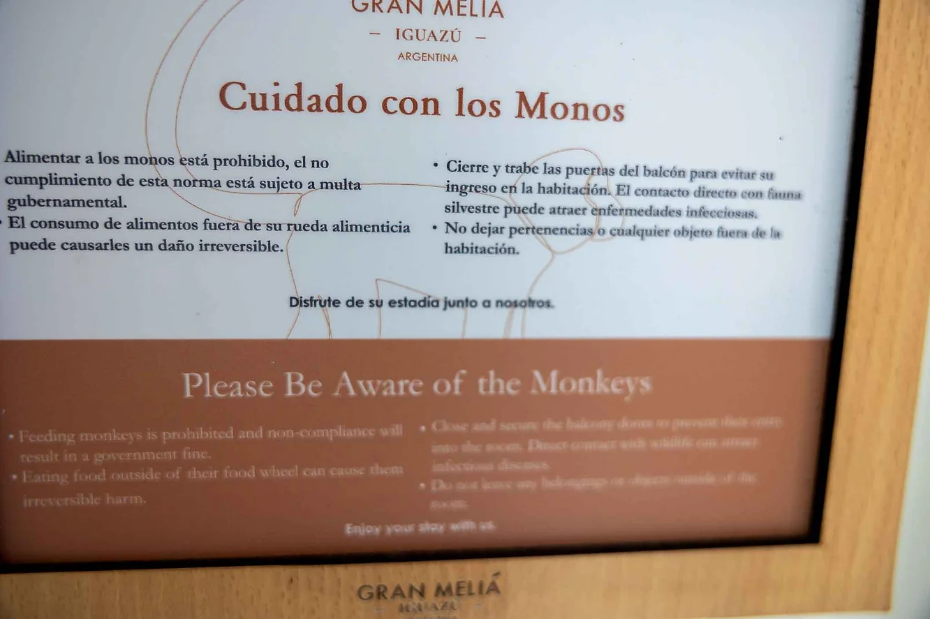 Sign from the hotel room door abou the monkeys