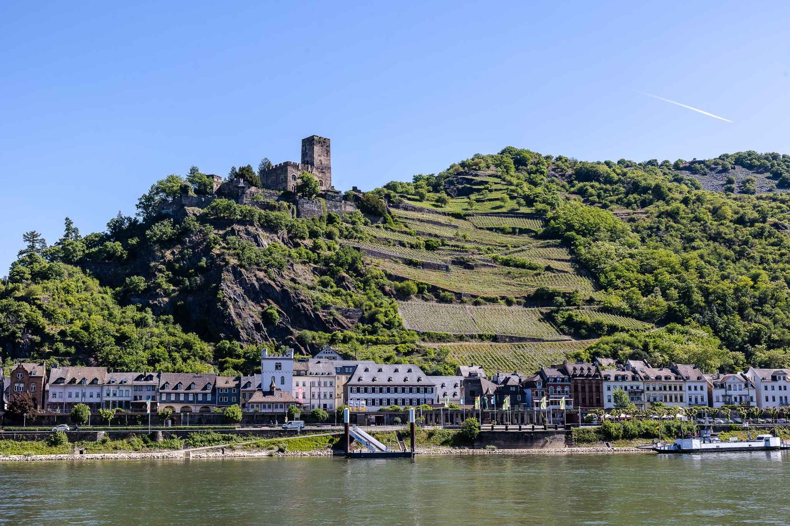 Villages along the Rhine River Gorge with stepped vineyards in the background