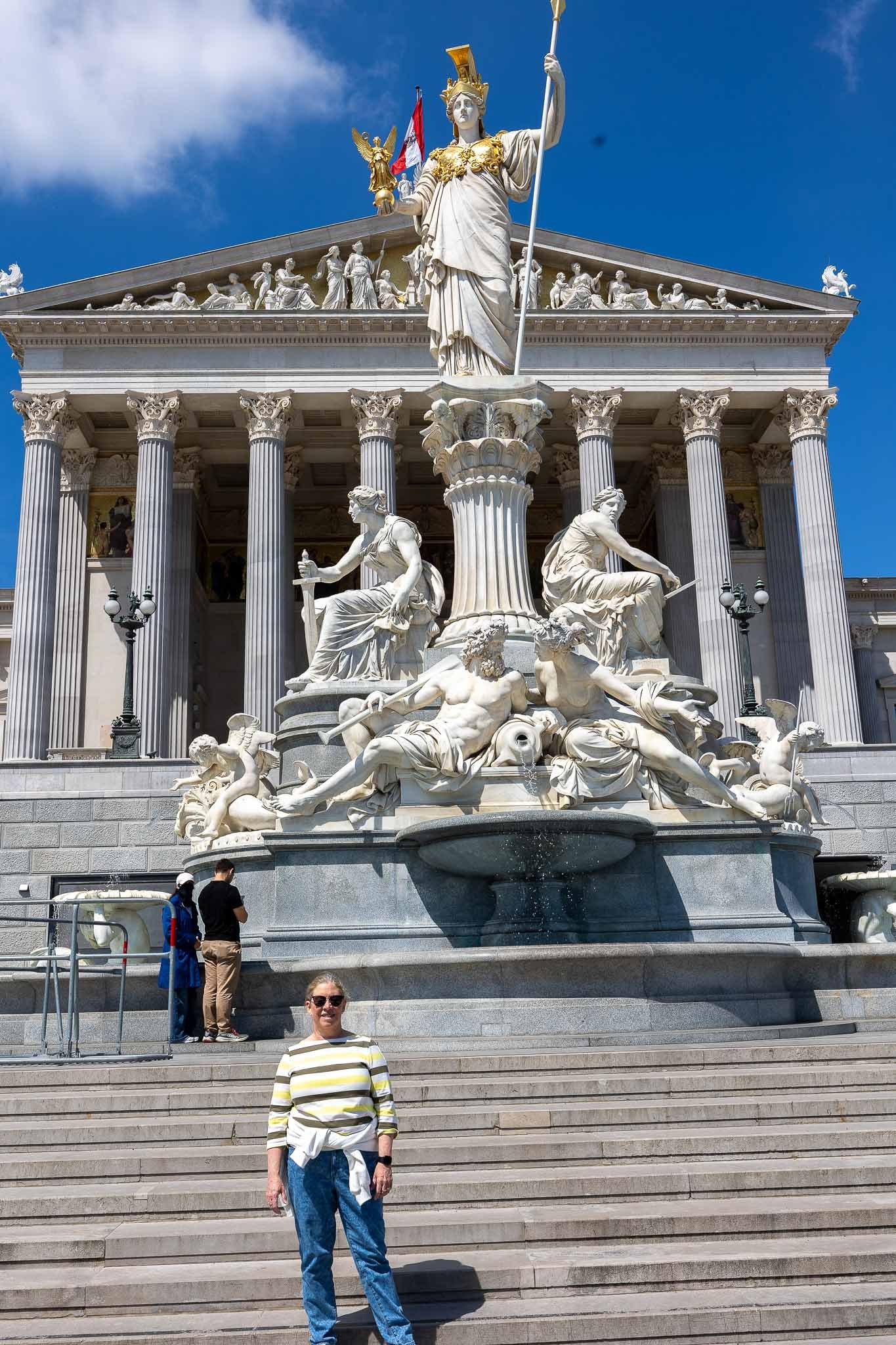 Shawn in front of the statue of Athena in front of Parliament