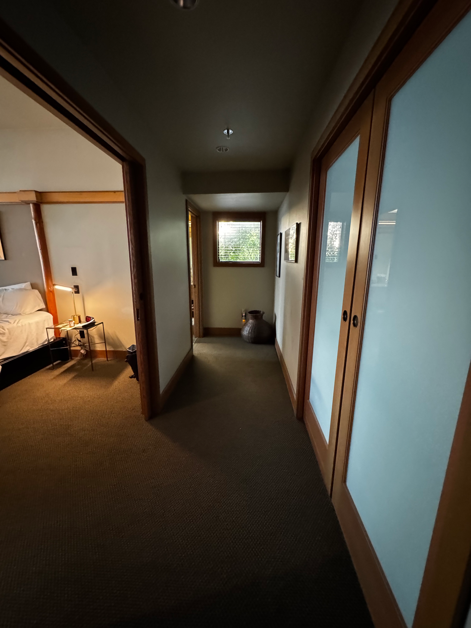 View walking into the room - main room off to the left, extra bedroom to the right